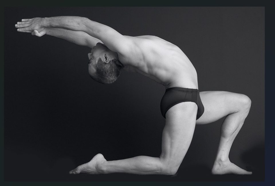 Tony Sanchez in a kneeling backbend
